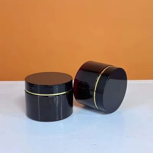 Hũ đựng kem body K 100g màu trắng/đen viền vàng có nắp lót